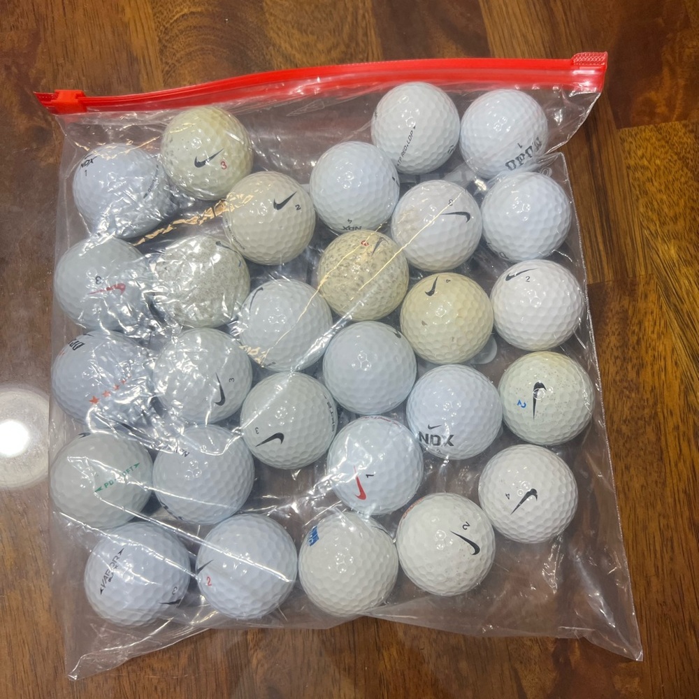 27 mixed nike golf balls